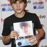 Justin Bieber holding a book